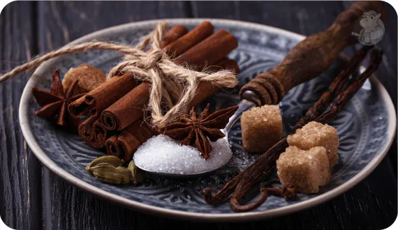 przygotowane przyprawy do kompotu z suszu: cynamon, anyż, wanilia, kardamon